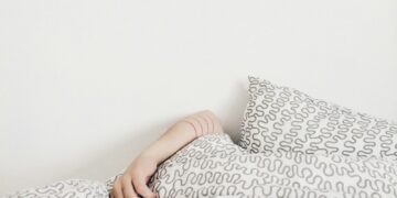 person lying on bed